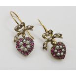 A pair of yellow metal diamond, pearl and red gem earrings, length 3cm, weight 2.8gms Condition