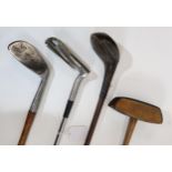 A SPALDING WATERFALL IRON hickory shaft, 95cm long, adjustable head steel iron, 99cm long, D