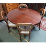 A Victorian mahogany oval tilt top breakfast table and four Victorian mahogany balloon back dining