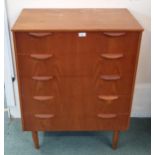 A mid 20th teak chest of five drawers, 100cm high x 73cm wide x 43cm deep Condition Report:Available