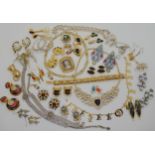 A collection of vintage costume jewellery to include a pair of Inca head earrings, items by D'