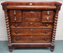 A Victorian mahogany Scotch chest of drawers with barley twist columns flanking central bank of