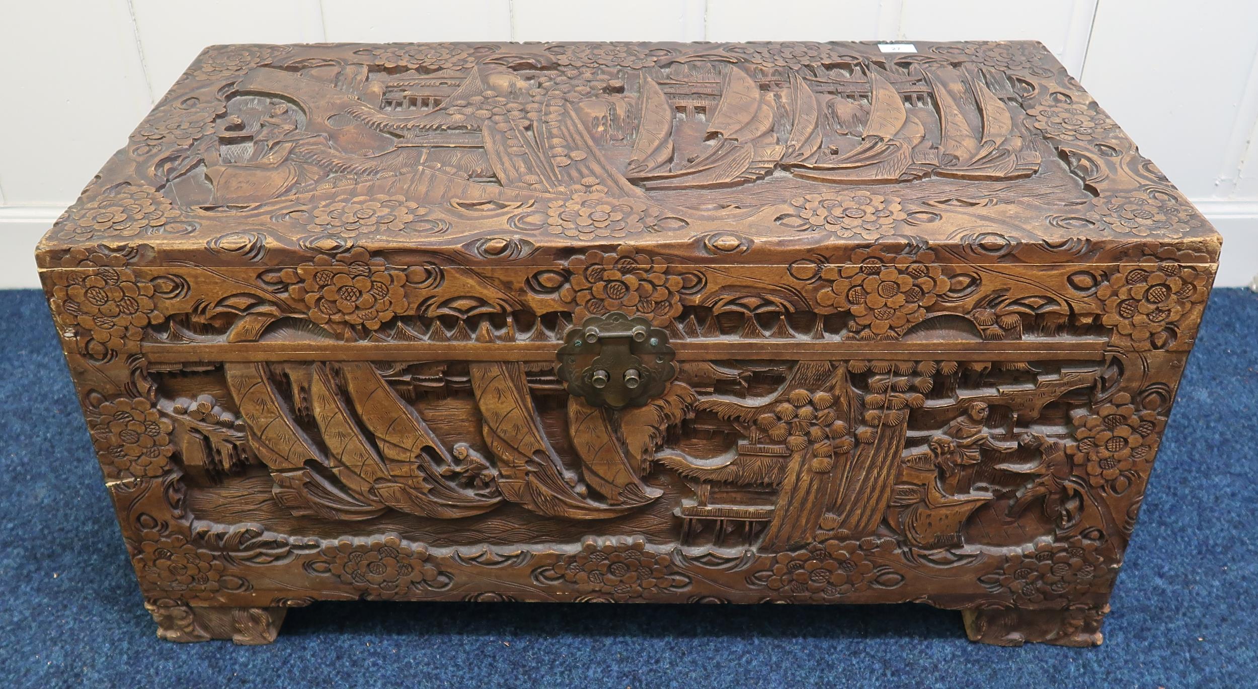 A 20th century carved Oriental camphorwood blanket chest, 48cm high x 98cm wide x 46cm deep