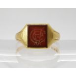 An 18ct gold signet ring set with an monogram cut carnelian. Finger size T, weight 5.5gms