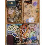 Two boxes of vintage costume jewellery to include, amber coloured beads, gold plated gate bracelet