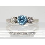 An 18ct white gold and platinum blue zircon and diamond accent ring, size K1/2, weight 2.2gms