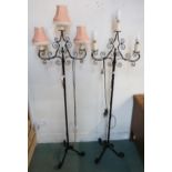 A pair of 20th century wrought iron three branch standard lamps, brass table lamp and a leather