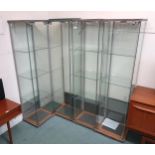 A lot of four contemporary glass display cabinets, 163cm high x 43cm wide x 37cm deep (4)