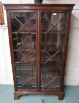 An early 20th century mahogany two door astragal glazed bookcase, 169cm high x 96cm wide x 40cm deep