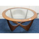 A mid 20th century teak G Plan Astra circular glass topped coffee table and another mid 20th century