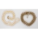 A 10K gold bracelet, length approx 18.5cm, weight 20.2gms, together with a string of pearls with a