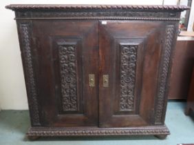 A Victorian stained oak two door cabinet, 133cm high x 148cm wide x 58cm deep Condition Report: