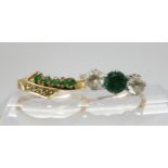 An emerald and diamond dress ring, size O1/2, together with a 9ct gold three stone ring with green