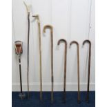 A lot of six assorted walking sticks and a shooting stick (7) Condition Report:Available upon