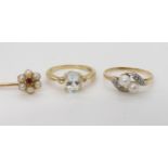 A yellow metal twin pearl and diamond ring, size N1/2, a 9ct aquamarine ring size N1/2, and a