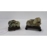 A Chinese hardstone horse on wooden stand and another group on stand Condition Report:Available upon