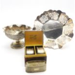 A collection of silver three silver napkin rings, Birmingham 1935 & 40, a continental white metal