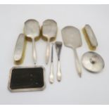 An eight piece silver dressing set, the bodies with engine turned decoration, by William Neale