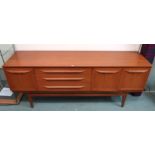 A mid 20th century teak Beautility sideboard, 75cm high x 184cm wide x 47cm deep Condition Report: