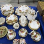 A Royal Albert Old Country Roses dinner service comprising two tureens, six plates, medium and