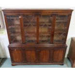 A 20th century mahogany astragal glazed bookcase with three glazed doors above three cabinet