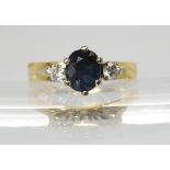 An 18ct gold retro high three stone sapphire and diamond ring, size L1/2, weight 3.5gms Condition