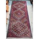 A multicoloured ground Kashgai Kilim rug with all over geometric design, 355cm long x 160cm wide