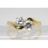 An 18ct gold twin diamond ring, set with estimated approx 0.50cts of brilliant cut diamonds