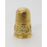 An 18ct three colour gold thimble with partial Georgian hallmarks 1825, makers mark CR possibly