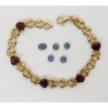 A 9ct gold garnet heart bracelet, length 19cm, weight 6.7gms together with five loose opal