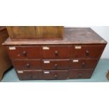 A late Victorian pine haberdashery style bank of nine drawers, 92cm high x 153cm wide x 65cm deep