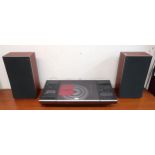 A Bang & Olufsen Beocenter 2000 turntable and two Bang & Olufsen Beovox S35 speakers (3) Condition