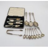 A collection of silver flatware including a pair of table spoons by William Bennett, London 1815,