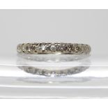 A white metal eternity ring set with diamonds (four tiny diamonds missing) finger size K, weight 2.