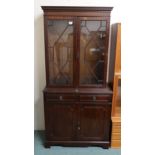 A 20th century mahogany astragal glazed bookcase on cabinet base and another mahogany astragal