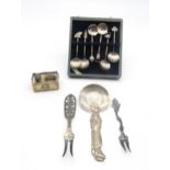 A collection of silver including a Japanese silver spoon modelled as a geisha, a Japanese silver