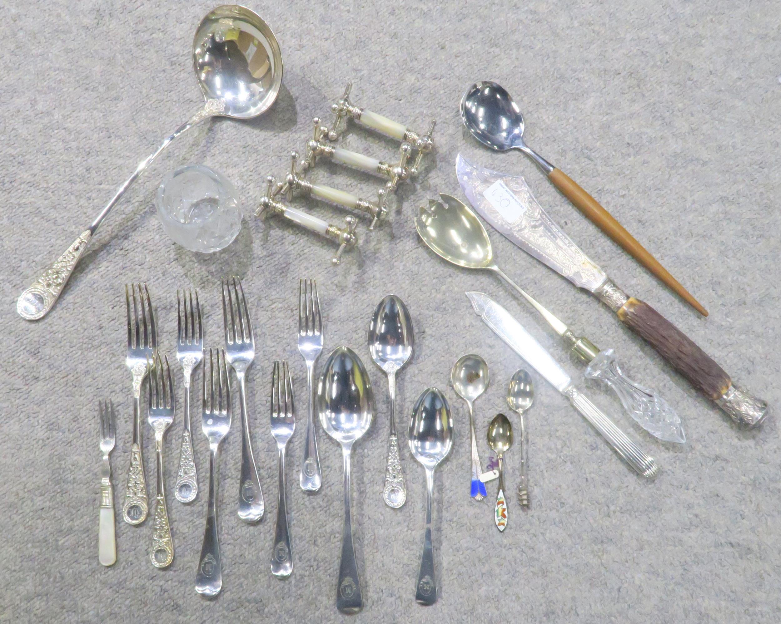 A quantity of EPNS comprising cased and loose cutlery, knife rests, carving sets, fish servers,