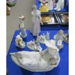 A large Nao figure of a reclining girl, other Nao's and Lladro's and a Royal Worcester figure