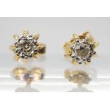A pair of 18ct gold diamond solitaire earrings in a decorative ball cage setting, set with estimated