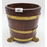 AN OAK STAVED AND BRASS BOUND BIN with paw feet, 24cm high Condition Report:Available upon request