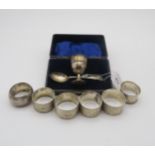 A set of four silver napkin rings, the bodies engine turned, by C W Fletcher & Son, Sheffield