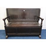 A 20th century stained oak monks bench, 99cm high x 131cm wide x 49cm deep Condition Report: