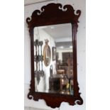 A Georgian style mahogany framed wall mirror and two rosewood framed overmantle mirrors (3)