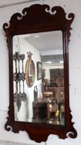 A Georgian style mahogany framed wall mirror and two rosewood framed overmantle mirrors (3)