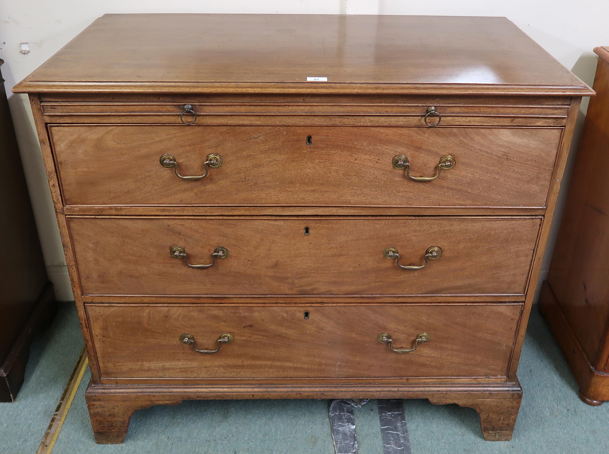 A Georgian mahogany three drawer chest on bracket feet, 99cm high x 111cm wide x 56cm deep Condition