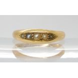 An 18ct gold five split pearl ring, hallmarked Birmingham 1898, size N, weight 3.1gms Condition