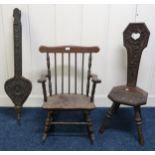 A 20th century oak spinning chair carved with thistles, rail back rocking chair and an oak set of