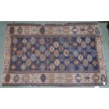 A blue ground Turkish Kazak rug with all over geometric design and cream borders, 190cm long x 127cm