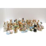 An extensive collection of Beswick Beatrix potter figures including Pig Wig, Pickles, Foxy whiskered