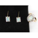 A pair of 18ct gold opal and diamond drop earrings, opals approx 6 x 4mm, surrounded with